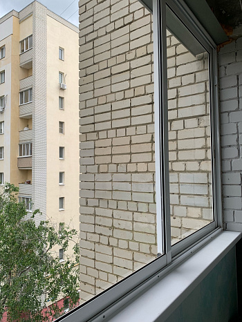 Остекление балкона раздвижными профилями Alumil фото